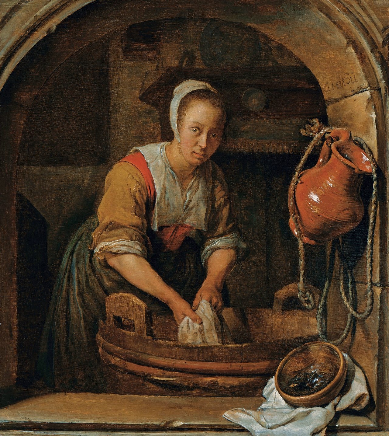 Woman washing textiles in a tub